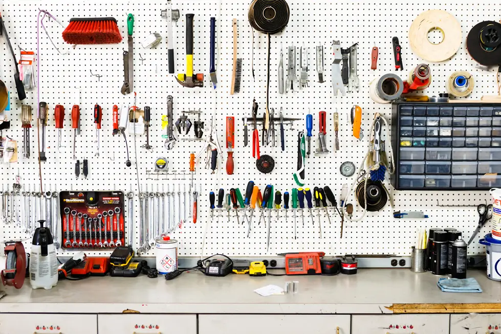 The Fas-Break shop's pegboard tool wall and workbench in Fremont