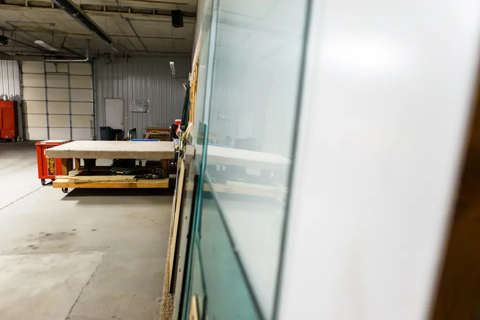Fas-Break shop floor with glass racks, a cutting table and the red Fas-Break tool chest